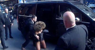 Fleur East smiles and makes quick recovery after tumbling out of a cab at Pride of Manchester Awards - www.ok.co.uk - Britain - Manchester