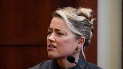 Amber Heard Denies Accusation That She Pooped the Bed, Says It Was the Dog - www.etonline.com - Los Angeles - California - county Heard