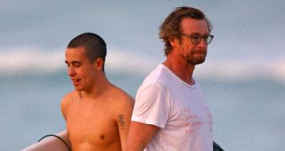 Simon Baker Goes for Dip in the Ocean While at the Beach with Son Harry - www.justjared.com - Australia - county Ocean