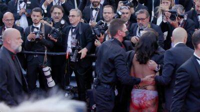 Screaming Woman Removed from Cannes Red Carpet After Crashing George Miller Film Premiere - variety.com