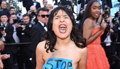 Topless Protester Storms the Red Carpet at Cannes 2022 Premiere - See Photos - www.justjared.com - France - New York - Ukraine