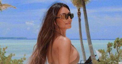 Kim Kardashian bares all in string bikini ahead of sister Kourtney's wedding - www.ok.co.uk - Italy