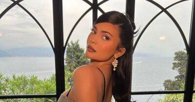 Kylie Jenner stuns in silver fitted gown as she celebrates Kourtney's wedding in Italy - www.ok.co.uk - Italy - county Brown