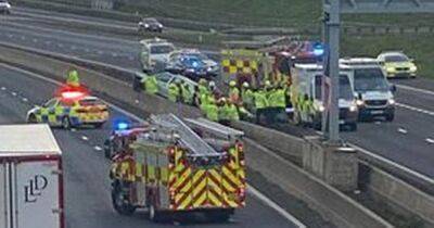 Car lands on M8 crash barrier near Eurocentral as two women rushed to hospital - www.dailyrecord.co.uk - Scotland