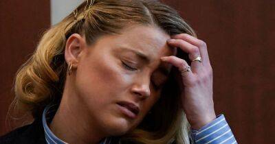 Amber Heard sobs and says people threaten to 'put her baby in a microwave' amid court case - www.ok.co.uk