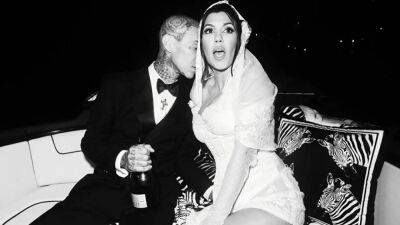Travis Barker Showers Kourtney Kardashian With PDA in New Wedding Photos - www.etonline.com