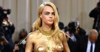 Cara Delevingne goes topless at Met Gala as she rips off jacket to expose gold-painted body - www.ok.co.uk - Britain - New York