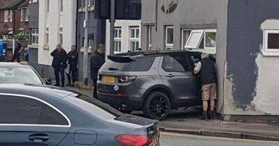 Police respond to 'major' incident as Range Rover crashes into building in Heald Green - www.manchestereveningnews.co.uk - county Lane