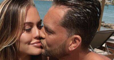 Lewis Burton plants kiss on pregnant girlfriend Lottie Tomlinson as she flaunts baby bump - www.ok.co.uk - Greece