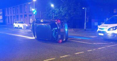 Man charged with dangerous driving after car flips over in crash - www.manchestereveningnews.co.uk - Manchester
