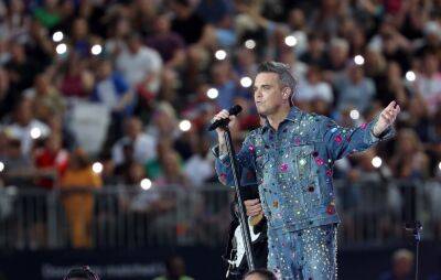 Robbie Williams announces 2022 greatest hits UK tour - www.nme.com - Britain - London - Manchester - Birmingham - Netherlands - Dublin