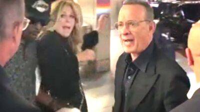 Tom Hanks Yells at Fans to 'Back the F**k Off' After They Cause Wife Rita Wilson to Trip - www.etonline.com - Hollywood - New York