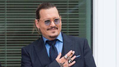 Johnny Depp Reacts to Winning Defamation Case Against Amber Heard - www.etonline.com