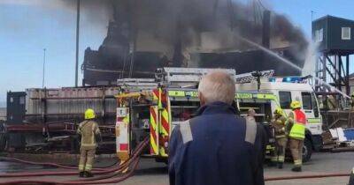 Boat engulfed in flames in Scots harbour as crews fight to battle blaze - www.dailyrecord.co.uk - Scotland