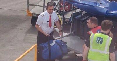 Pilot at Edinburgh airport spotted helping load luggage on to plane - www.dailyrecord.co.uk - Britain - Scotland - Beyond