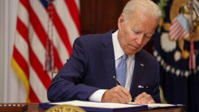 President Biden Signs Bipartisan Gun Control Bill Into Law - www.etonline.com