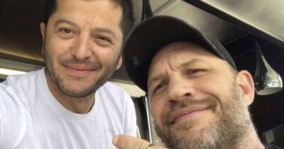 Tom Hardy spotted grabbing bite to eat at Cranleigh pizza van and shows he's just like the rest of us - www.msn.com - county Nolan