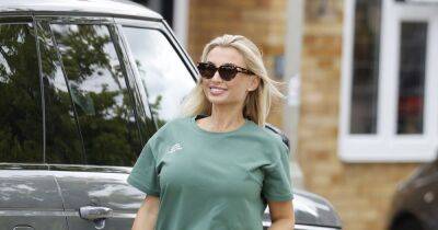Billie Faiers proudly shows off her blossoming baby bump in slinky cycling shorts - www.ok.co.uk - Dubai