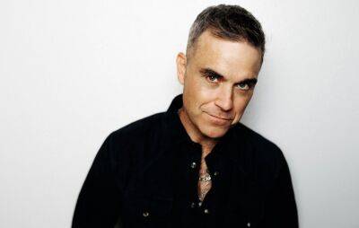 Robbie Williams jokes he could play Knebworth again if he “sold tickets as cheaply” as Liam Gallagher - www.nme.com