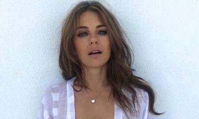 Elizabeth Hurley is red hot in low-cut dress slashed to the navel – fans react - hellomagazine.com