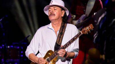 Guitarist Carlos Santana Hospitalized After Collapsing Onstage From 'Exhaustion and Dehydration' - www.etonline.com - Pennsylvania - city Santana - Lake - Michigan