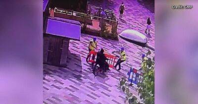 Moment police officers disguised as builders arrest men at university campus - www.manchestereveningnews.co.uk - Manchester