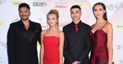 Emily Andre and stepdaughter Princess match in red gowns at charity ball with Peter and Junior - www.ok.co.uk