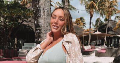 Charlotte Crosby displays blossoming bump in babymoon pics as she counts down to due date - www.ok.co.uk - county Crosby - Mauritius