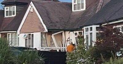 Man arrested after car ploughs into home leaving front wall 'collapsing' - www.manchestereveningnews.co.uk - Manchester