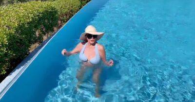 Joan Collins, 89, sends fans wild as she dances around swimming pool in blue bikini - www.dailyrecord.co.uk - Britain - London