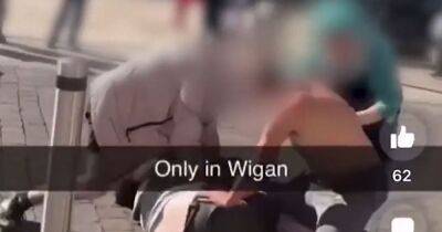 "Only in Wigan": Pie shop worker splits up town centre fight in dramatic TikTok video - www.manchestereveningnews.co.uk - Manchester - city Wigan