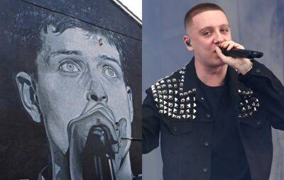 Aitch addresses mural of Joy Division’s Ian Curtis being painted over for album ad: “Getting fixed as we speak” - www.nme.com - Manchester