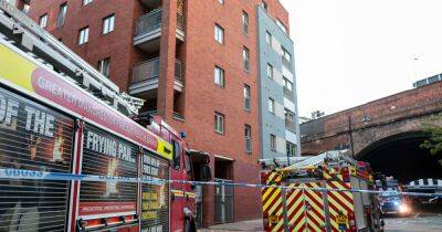 Crews tape off Manchester city centre street after blaze in high rise building - www.manchestereveningnews.co.uk - Manchester