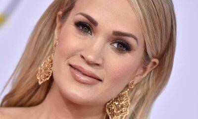Carrie Underwood looks breathtaking in sheer ballgown during special performance - hellomagazine.com - USA