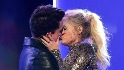 Meghan Trainor Makes a Playful Dig at Charlie Puth Over Their 2015 Awards Show Kiss - www.etonline.com - USA