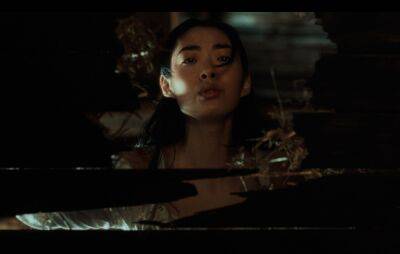 Watch Rina Sawayama break free from 19th century time loop in ‘Hold The Girl’ video - www.nme.com