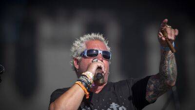 Guy Fieri on Cooking With Country's Biggest Stars at Stagecoach Smokehouse (Exclusive) - www.etonline.com - USA - California - county Brown - county Bryan - county Kane