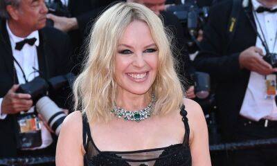 Kylie Minogue sizzles in striking silver dress to announce exciting news - hellomagazine.com - Britain