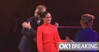 Meghan Markle is regal in red as she’s cheered on first stop of unofficial Royal tour - www.ok.co.uk - Britain - Manchester - county Windsor - city Windsor