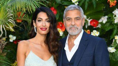 George and Amal Clooney Are a Glamorous Pair at 'Ticket to Paradise' Red Carpet Premiere - www.etonline.com - Britain