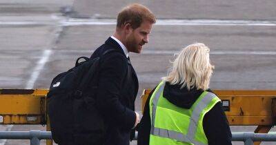 Prince Harry comforts airport worker by putting an arm round her during solo London return - www.ok.co.uk - Britain - Scotland - county King And Queen