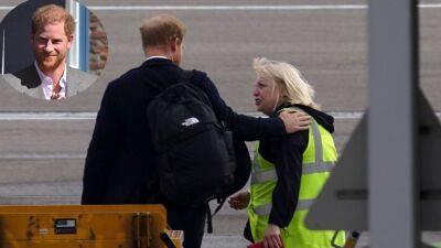 Prince Harry Appears to Comfort Worker While Boarding Plane Following Queen Elizabeth's Death - www.etonline.com - Scotland - London - county Andrew - county Prince Edward