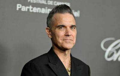 Netflix reveals Robbie Williams documentary release date in new trailer - www.nme.com