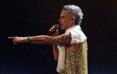 A Robbie Williams pop-up event is coming to London - www.nme.com - London