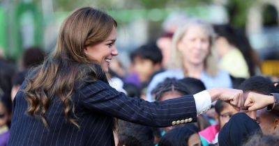 Kate Middleton's perfect in pinstripes as she fist bumps schoolchildren in Cardiff - www.ok.co.uk - Britain