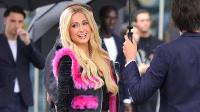 Paris Hilton’s Hot Pink Faux Fur Vest Is Giving Your Favorite Seasonal Lindsay Lohan Character - www.glamour.com