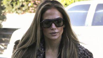Jennifer Lopez Does Mick Jagger Cosplay in a Luxe Duster Coat Over a Nude Illusion Mesh Bodysuit - www.glamour.com - Los Angeles