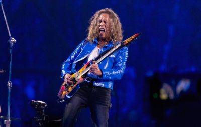 Watch Metallica’s Kirk Hammett fall on stage, swear and angrily toss guitar - www.nme.com - Detroit - city Amsterdam