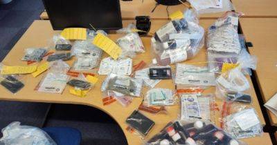Police officers storm property and discover suspected drugs and fake money - www.manchestereveningnews.co.uk - Manchester - county Denton
