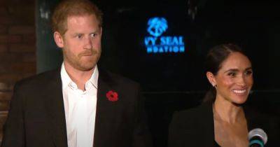 Prince Harry looks sombre alongside a beaming Meghan Markle in first outing since birthday row - www.ok.co.uk - county San Diego - county King And Queen